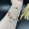 Vòng đá đào hoa mix charm bướm bạc 925 - VT2400097DDHO
